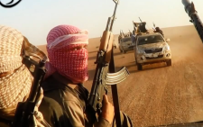 An image grab taken from a propaganda video uploaded on 8 June 2014, by the jihadist group the ISIS allegedly shows the militants driving in vehicles near the central Iraqi city of Tikrit. Picture: AFP. 