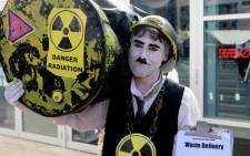 An activist is seen protesting at the Nersa hearings into Eskom's proposed new electricity tariff structure in Cape Town on 15 January 2013. Picture: Nardus Engelbrecht/SAPA