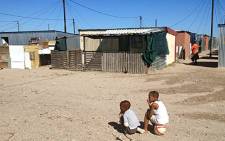 Children play outside their homes in Blikkiesdorp. Picture: Nathan Adams/EWN