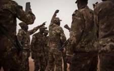Malian soldiers dance after the handover ceremony of the Barkhane military base by the French army in Timbuktu on 14 December 2021. Picture: AFP