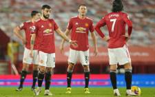Manchester United midfielder Bruno Fernandes (L) and teammates react after conceding their second goal during the English Premier League football match between Manchester United and Sheffield United at Old Trafford in Manchester, north west England, on 27 January 2021. Picture: Dave Thompson /AFP