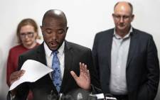 Mmusi Maimane announces his resignation as DA leader, with Helen Zille and Athol Trollip in the background, on 23 October 2019. Picture: Sethembiso Zulu/EWN