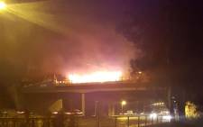 A view of the burning train at the Maraisburg Bridge. Picture: @GTP_Traffstats/Twitter.