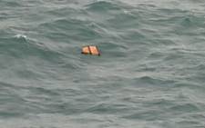 Photo taken from an Indonesian aircraft over the Java Sea shows possible plane debris from the missing AirAsia flight. Picture: AFP.
