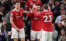 Manchester United striker Cristiano Ronaldo (C) celebrates with teammates after scoring their third goal during the English Premier League football match between Manchester United and Burnley at Old Trafford in Manchester, north-west England, on 30 December 2021. Picture: Oli SCARFF/AFP