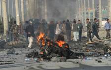 A suicide bomber blew herself up alongside a minivan carrying foreigners on a major highway leading to the international airport in the Afghan capital, police said, killing at least 12 people, including nine foreigners. Picture: AFP.