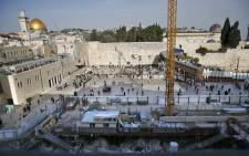 A picture taken on 1 March 2018 shows a general view of construction work in the Western Wall plaza of Jerusalem's Old City with the Dome of the Rock mosque in the al-Aqsa compound in the background. Picture: AFP.