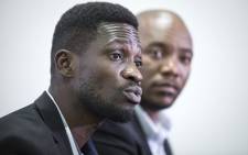 FILE: Pop star turned Uganda's leading opposition figure Bobi Wine (L), attends a briefing on the state of freedom in African politics in Johannesburg, South Africa, on 12 December 2019. Picture: AFP