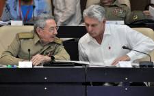 FILE: Cuban President Raul Castro (L) and First Vice president Miguel Diaz-Canel speak during the Permanent Working Committees of the National Assembly of the People's Power in Havana, on 14 July 2017. Picture: AFP