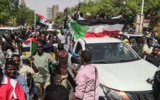 Sudanese protesters march towards the military headquarters during an anti-regime rally in the capital Khartoum on 11 April 2019. Picture: AFP.