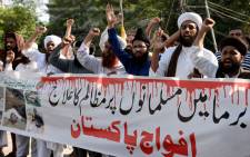 Workers of Tehreek Labaik Ya Rasool religious group shout slogans against the violence against Muslims in Myanmar during a protest in Lahore, Pakistan on 1 September 2017. Picture: AFP
