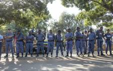 FILE: Police officers guard the Hoerskool Overvaal on 17 January 2018 following protests over an admissions row between the school and the Gauteng Education Department. Picture: Ihsaan Haffejee/EWN