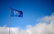 A flag of the UNited Nations floats at their Geneva’s offices during the third day of face-to-face peace talks in Geneva on 27 January 2014. Picture: AFP.