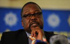 FILE:Police Minister Nkosinathi Nhleko speaks at the release of the 2013/2014 annual crime statistics in Pretoria on 19 September 2014. Picture: Sapa.