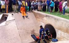 The boy's body was recovered after he disappeared into a stormwater drain several days ago. Picture: Vumani Mkhize/EWN. 