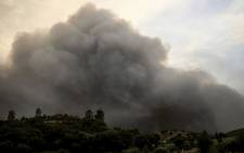 Smoke columns rise due to a wildfire close to Monchique in the Portuguese Algarve, on August 4, 2018. Picture: AFP.