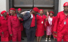 Leader of the EFF Julius Malema is adamant red hard hats, overalls and matching gumboots are not going anywhere. Picture: EWN.