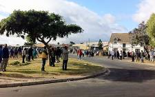 FILE: Farmworkers gather outside a bus depot in Pineview, Grabouw. Picture: EWN