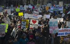 Protesters march on Pennsylvania Avenue while protesting against US President Donald Trump’s recent action on refugees entering the US on 4 February, 2017, in Washington, DC. Picture: AFP.