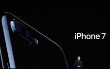 FILE: Apple CEO Tim Cook introduces the new iPhone 7 during an event inside Bill Graham Civic Auditorium in San Francisco, California on 7 September 2016. Picture: AFP.