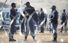 Police closely monitor protests in Marikana in the North West on 14 August 2012. Picture: Taurai Maduna/EWN