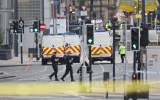 FILE: Armed police patrol near Manchester Arena following a deadly terror attack in Manchester, north-west England on 23 May 2017. Picture: AFP