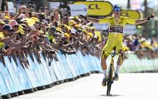 Jumbo-Visma team's Belgian rider Wout Van Aert celebrates as he cycles past the finish line to win the 4th stage of the 109th edition of the Tour de France cycling race, 171,5 km between Dunkirk and Calais, in northern France, on 5 July 2022. Picture: Anne-Christine POUJOULAT / AFP