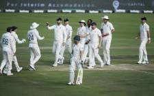 South Africa's Dean Elgar (front C) walks back to the pavilion after his dismissal by England's Jofra Archer during the second day of the first Test cricket match between South Africa and England at SuperSport Park Stadium at Centurion near Pretoria on 27 December 2019. Picture: AFP