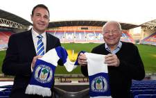 Wigan Athletic owner Dave Whelan (R) welcomes new manager Malky Mackay to the club on 19 November 2014. Picture: Official Wigan Athletic Facebook page.