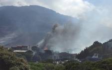 A house catches fire in Murdock Valley, Simons Town in Cape Town. Picture: Aletta Harrison/EWN