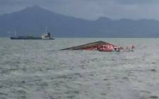 Rescuers search for survivors next to the capsized passenger ferry off Ormoc City, central Philippines on 2 July 2015. Picture: AFP.