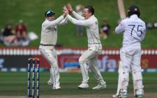 New Zealand's Michael Bracewell (C) and teammate Tom Latham (L) celebrate Sri Lanka's Dhananjaya de Silva (R) being caught during day four of the second cricket Test match between New Zealand and Sri Lanka at the Basin Reserve in Wellington on 20 March 2023. Picture: Marty MELVILLE/AFP