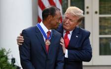 US President Donald Trump presents golfer Tiger Woods with the Presidential Medal of Freedom during a ceremony in the Rose Garden of the White House in Washington, DC, on 6 May 2019. Picture: AFP