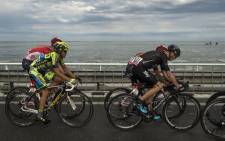 Spain’s Alberto Contador and Brit Chris Froome ride the pack in the Tour de France on 5 July 2015. Picture: AFP.