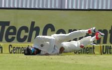 India captain Virat Kohli dives to stop a Peter Handscomb drive from reaching the boundary. Picture: Twitter/@BCCI.