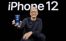 In this photo released by Apple, Apple CEO Tim Cook holds up the all-new iPhone 12 Pro during an Apple event at Apple Park in Cupertino, California on 13 October 2020. Picture: AFP