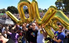 Supporters of the same-sex marriage "Yes" vote gather to celebrate the announcement in a Sydney park on 15 November 2017. Picture: AFP