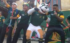 Musician Lloyd Cele performs on stage with fans and the Springboks' mascot. Picture: Vumani Mkhize.