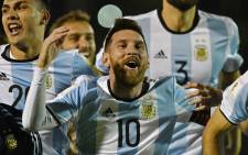 Argentina's Lionel Messi celebrates after defeating Ecuador and qualifying to the 2018 World Cup football tournament in Quito, on 10 October 2017. Picture: AFP.