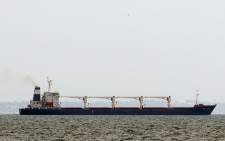FILE: Bulk carrier M/V Razoni, carrying a cargo of 26,000 tonnes of corn, leaves Ukraine’s port of Odessa, en route to Tripoli in Lebanon, on August 1, 2022, amid Russia's military invasion launched on Ukraine. The first shipment of Ukrainian grain left the port of Odessa on August 1 under the under the Black Sea Grain Initiative deal signed in Istanbul, on 22 July, aimed at relieving a global food crisis following Russia's invasion of its neighbour, the Turkish defence ministry said. Picture: Oleksandr GIMANOV / AFP