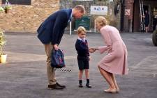 Britain's Prince George arrives for his first day of school at Thomas's Battersea with his father Prince William, the Duke of Cambridge. Picture: @KensingtonRoyal/Twitter