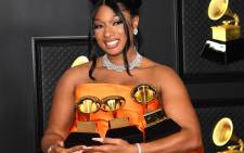 In this handout photo courtesy of The Recording Academy, Megan Thee Stallion, winner of the Best Rap Performance and Best Rap Song awards for 'Savage' and the Best New Artist award, poses in the media room during the 63rd Annual GRAMMY Awards at Los Angeles Convention Center on March 14, 2021 in Los Angeles, California. Picture: Kevin Mazur / The Recording Academy / AFP.