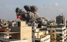 Smoke plumes rising following an Israeli air strike in Gaza City on 14 July 2018. Picture: AFP