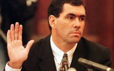 FILE: Hansie Cronje raises his hand to take the oath prior to testifying before the King Commission of Inquiry into allegations of cricket match-fixing in Cape Town 15 June 2000. Picture: AFP