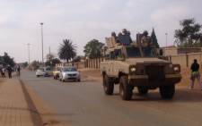 South African National Defence Force cars were deployed to patrol the street of Bekkersdal ahead of the national elections. Picture: Govan Whittles/EWN.