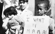 A black child demonstrates to have his mother released in May 1960 in front of Johannesburg's city hall. In the preceding weeks, more than 500 black South Africans were arrested after the Sharpeville massacre. Picture: AFP.