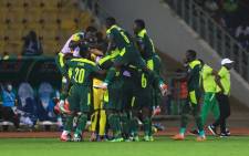 Senegal's players celebrate their team's first goal during the Africa Cup of Nations (CAN) 2021 semifinal football match between Burkina Faso and Senegal at Stade Ahmadou-Ahidjo in Yaounde on 2 February 2022. Picture: DANIEL BELOUMOU OLOMO/AFP