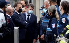 French President Emmanuel Macron (3rd-L) and Nice Mayor Christian Estrosi (4th-L) visit the scene of a knife attack at the Basilica of Notre-Dame de Nice in Nice on 29 October 2020. Picture: AFP
