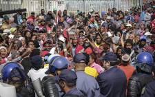 Police were called in to disperse hundreds of unruly protesters during their march to the Theewaterskloof Municipal office on 15 September 2014. Picture: Thomas Holder/EWN