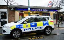 FILE: A police car is seen parked outside Leytonstone station in north London. Picture: AFP.